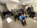 Group of Precision Air Heating & Cooling team members gathered in an office setting, showcasing camaraderie and teamwork, emphasizing their commitment to quality HVAC services in Pennsylvania.