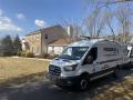 Precision Air service van parked in front of a residential home, showcasing HVAC solutions for local families in West Chester, PA.