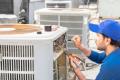 HVAC technician repairs an AC unit in Chadds Ford, ensuring efficient cooling for homes and businesses. Quality service in West Chester, PA.