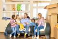 Family in their new home surrounded by moving boxes. Boiler Installation Services in West Chester, PA, can help make your house a home.