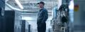 HVAC technician standing in a modern facility, surrounded by heating and cooling equipment, emphasizing the importance of routine HVAC maintenance for home comfort in Glen Mills.