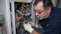 technician conducting furnace repair