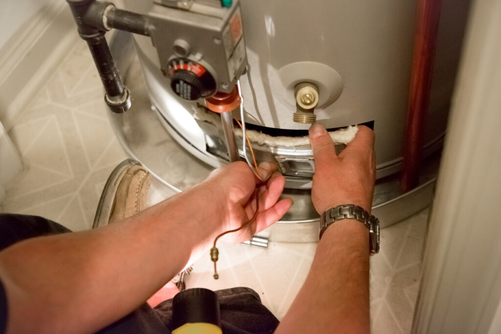 Technician working on a water heater