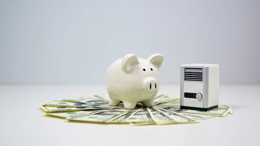 Piggy bank on a fan-shaped arrangement of dollar bills, symbolizing cost savings on HVAC replacement in West Chester PA.