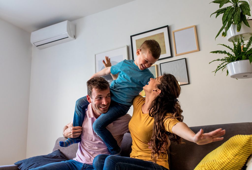 Happy family enjoying quality time at home with efficient heat pump system.
