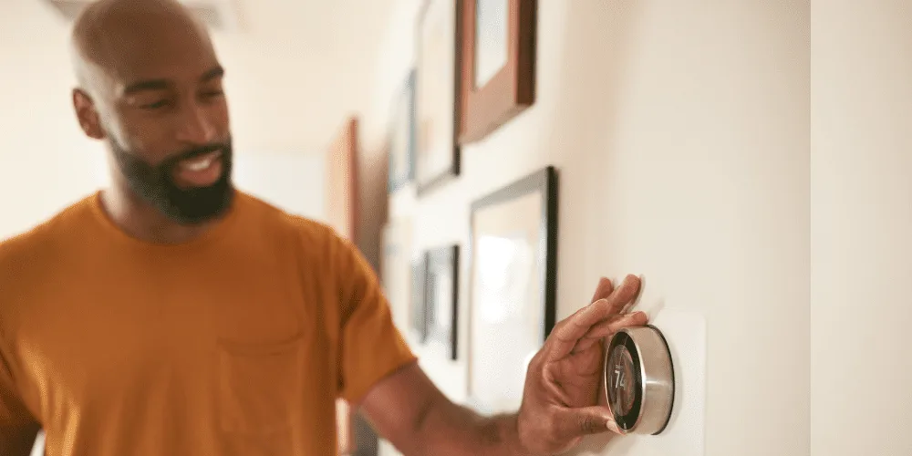 A programmable thermostat on a West Chester wall